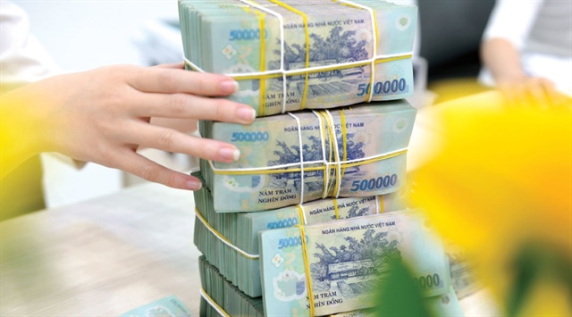 Tín dụng tăng mạnh và sức ép thanh khoản